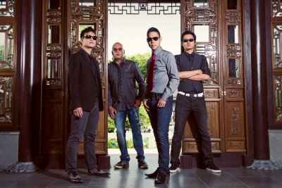 A photo of the four members of the band The Slants