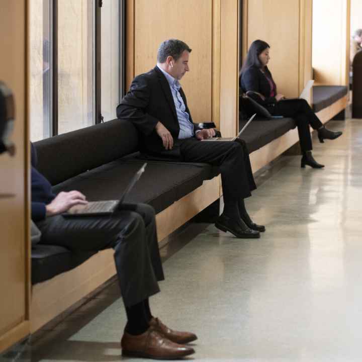 Legislators sitting down and waiting